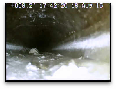 sewer scope inspection camera reveals buildup in the side sewer